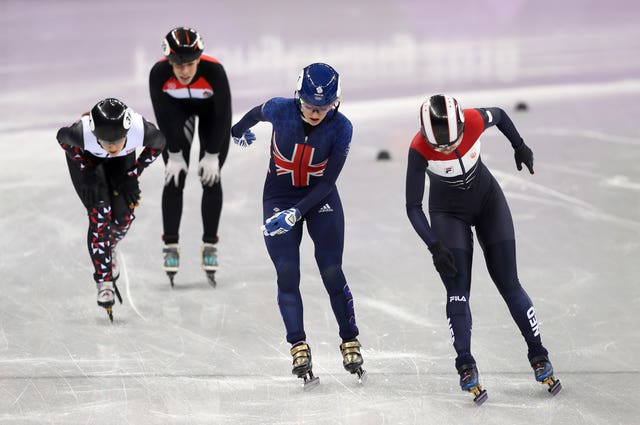 Elise Christie finished second, but was relegated after two indiscretions resulted in a yellow card