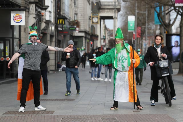 People dressed up to celebrate St Patrick’s day on O’Connell Street in Dublin