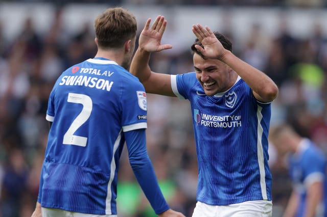 Regan Poole (right) celebrates for Portsmouth