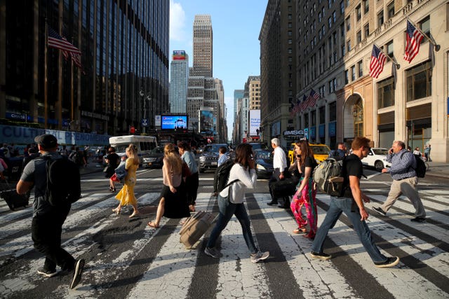 Pedestrians cross a road in New York