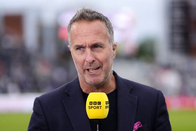 Michael Vaughan holding mic on pundit duty