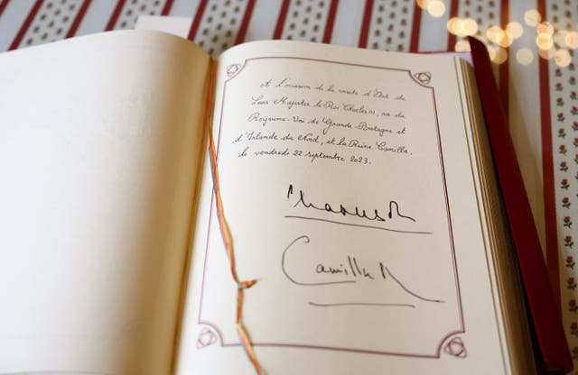 The guest book signed by Charles and Camilla