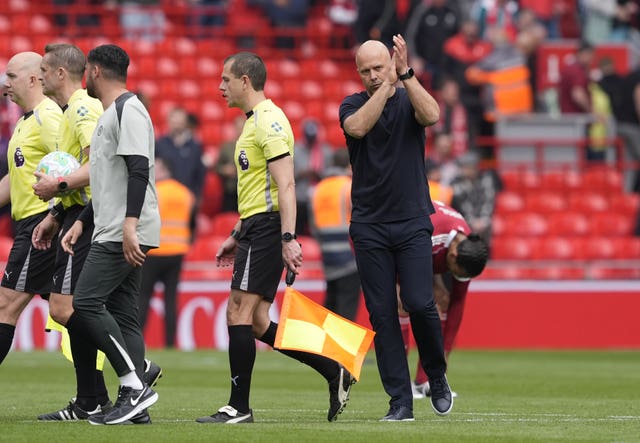 Arne Slot applauds the Liverpool fans