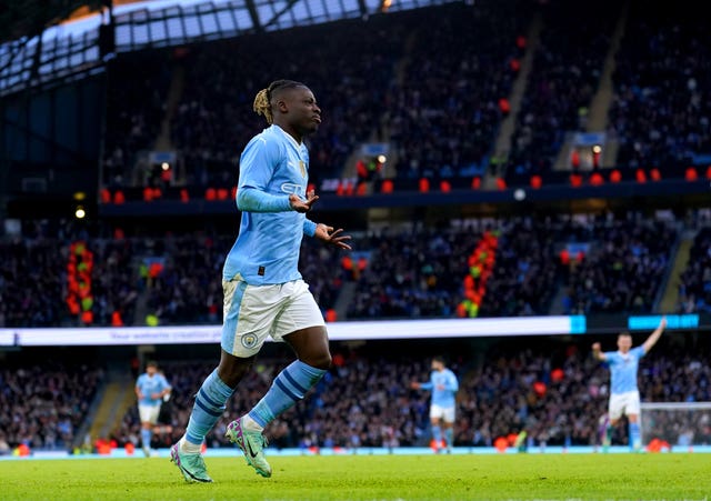 Jeremy Doku celebrates his goal against Huddersfield