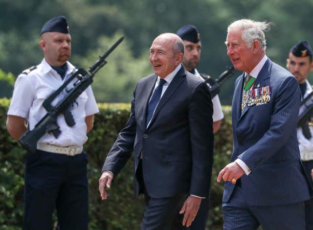 Charles with French interior minister Gerard Collomb (Andrew Matthews/PA)PA)