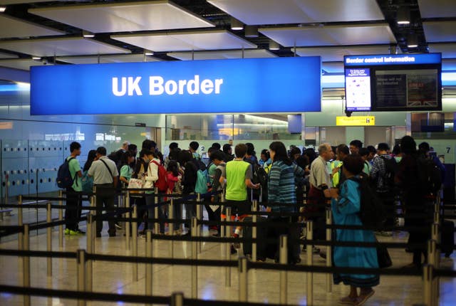 Passengers have been warned to expect longer immigration queues on strike days (Steve Parsons/PA)