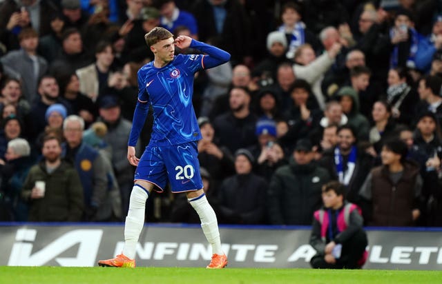 Chelsea’s Cole Palmer celebrates scoring by raising his hand to his ear