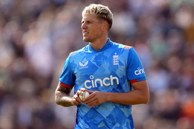 Brydon Carse clutches the ball on England duty in 2024.