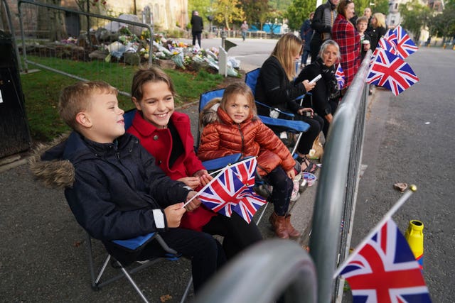 Members of the public lining the streets 