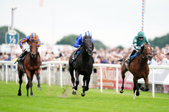 Frankie Dettori stepped in for a suspended Jim Crowley at York as Mostahdaf beat Paddington (left) and Nashwa (right)