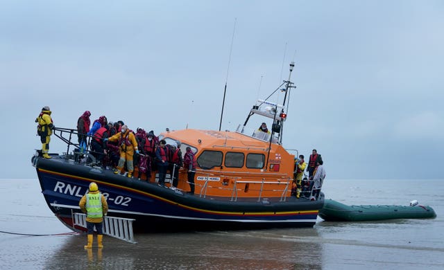 A group of people thought to be migrants are brought in to Dungeness, Kent, by the RNLI following a small boat incident in the Channel