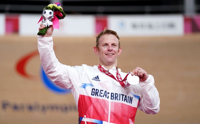 Jody Cundy celebrates on the podium with his silver medal following the men's C4/C5 1000m time trial