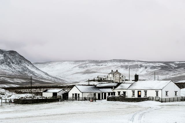 A farm house blanketed by overnight snow near Langdon Beck in the North Pennines (Danny Lawson/PA)