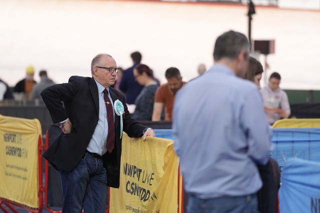 An observer from Reform UK watches as votes are counted in Newport 