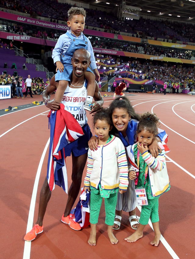 Great Britain’s Mo Farah celebrates with his children Amani Farah, Aisha Farah, Rhianna Farah, Hussein Mo Farah after winning the Men’s 10,000m during day one of the 2017 IAAF World Championships at the London Stadium.