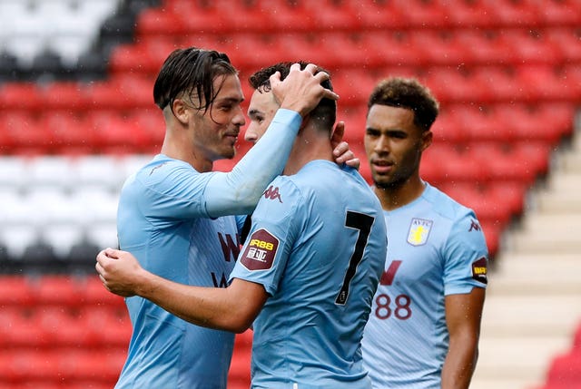 Jack Grealish, left, and John McGinn, centre