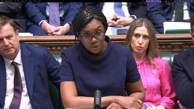 Kemi Badenoch speaking in the Commons while her shadow front bench team behind her listen
