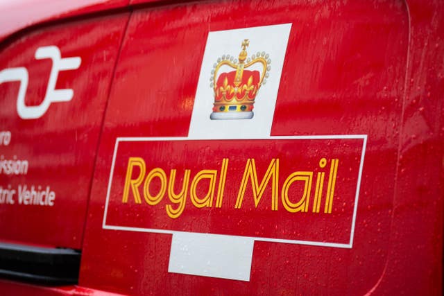A Royal Mail logo on a van 
