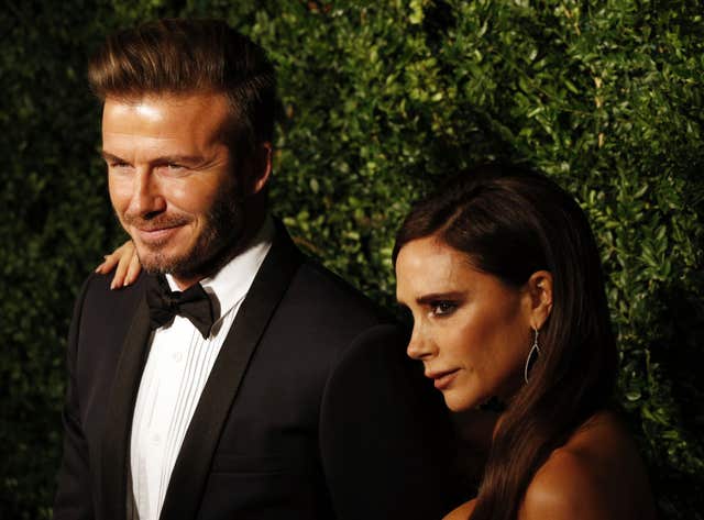Sir David Beckham with his wife Victoria