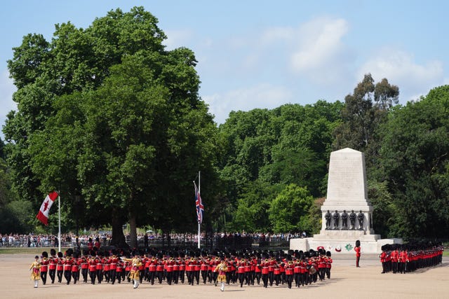 Members of the Coldstream Guards prepare for Trooping the Colour at Horse Guards Parade