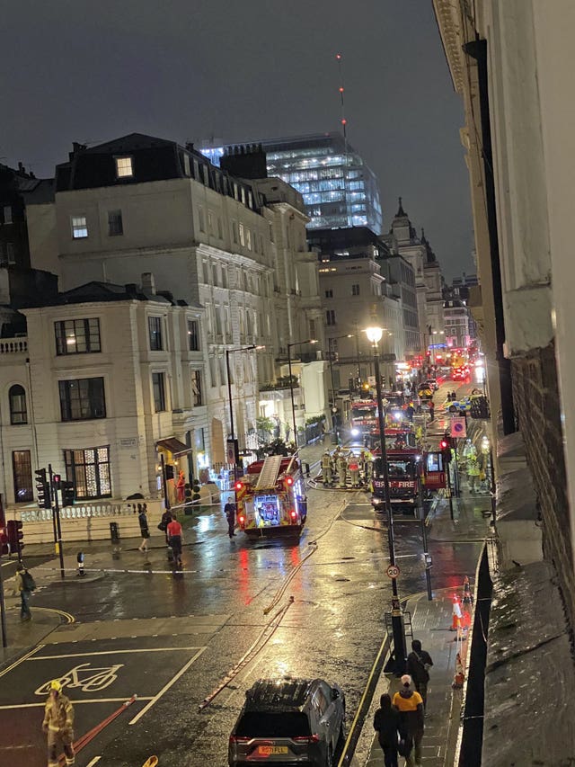 Photo taken with permission from the Twitter feed of @Al_prof of firefighters tackling a blaze at a five-storey hotel near Paddington railway station in central London 