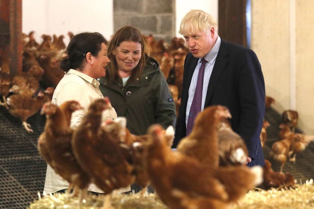 Boris Johnson meeting two farmers