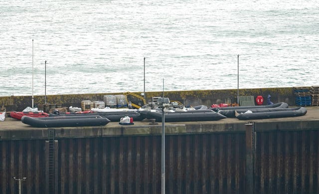 Boats used in previous crossings on the quayside after a group of people thought to be migrants are brought in to Dover