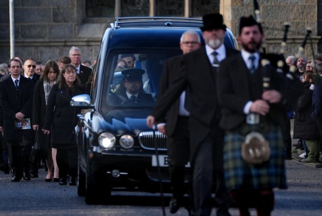 Gail Hendry (third left), the sister of Alex Salmond, follows the funeral cortege as it leaves the funeral service for former first minister of Scotland Alex Salmond