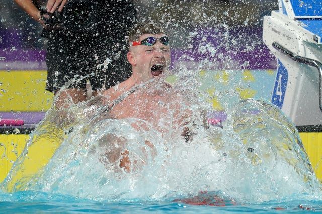 Adam Peaty roars in delight after winning the 50m breaststroke gold medal