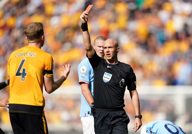 Wolves defender Nathan Collins is sent of for a challenge on Manchester City's Jack Grealish