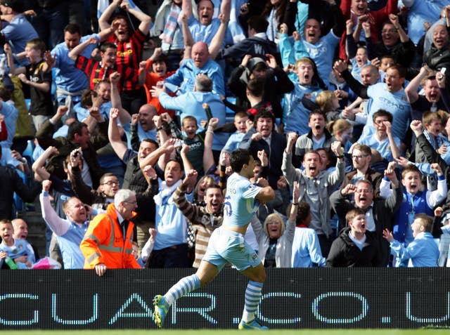 Sergio Aguero celebrates after scoring against QPR to clinch Manchester City's first Premier League title