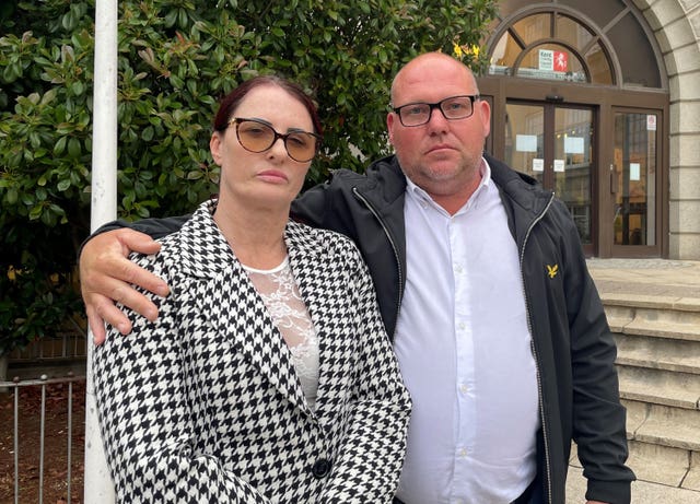 Nicola Foster, the mother of Samantha Mulcahy, and her stepfather Mark Trainer outside County Hall in Maidstone