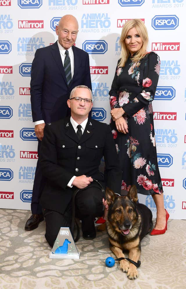 Finn and Pc Dave Wardell with Sir Patrick Stewart and Michelle Collins at the Animal Hero Awards (Ian West/PA)