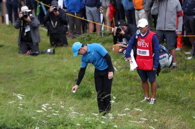 Rory McIlroy takes a drop of the first hole at Royal Portrush