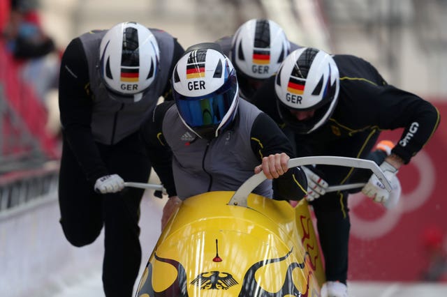 Germany, piloted by Francesco Friedrich, led the way at the halfway stage of the men's four-man bobsleigh