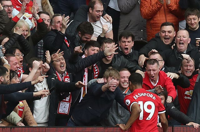 Marcus Rashford, bottom right, celebrates with Manchester United fans after scoring against Liverpool in 2018