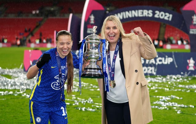 Emma Hayes, right, and Fran Kirby lift the FA Cup together