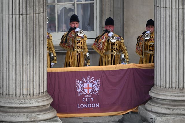 Trumpeters sound a Royal Salute during the Proclamation of Accession of King Charles III at the Royal Exchange in the City of London 