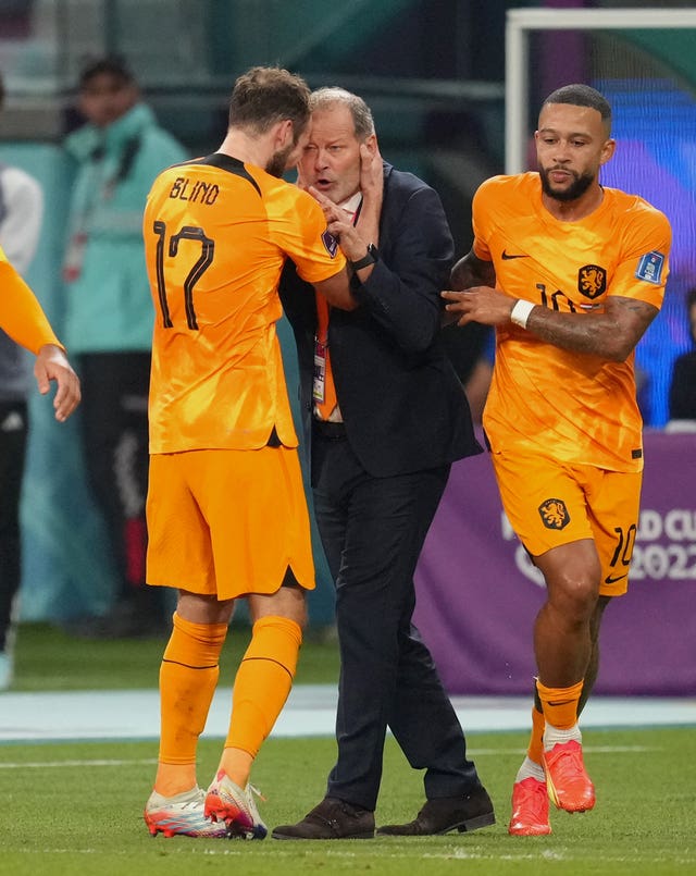 Netherlands’ Daley Blind (left) celebrates his goal with his father Danny