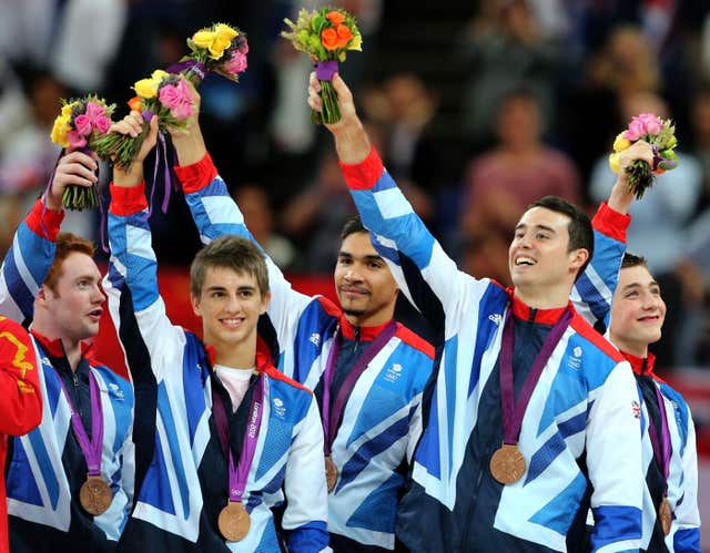 Daniel Purvis (left to right), Max Whitlock, Louis Smith, Kristian Thomas and Sam Oldham celebrate