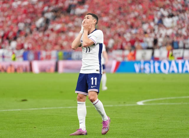 England's Phil Foden covers his face with his hands