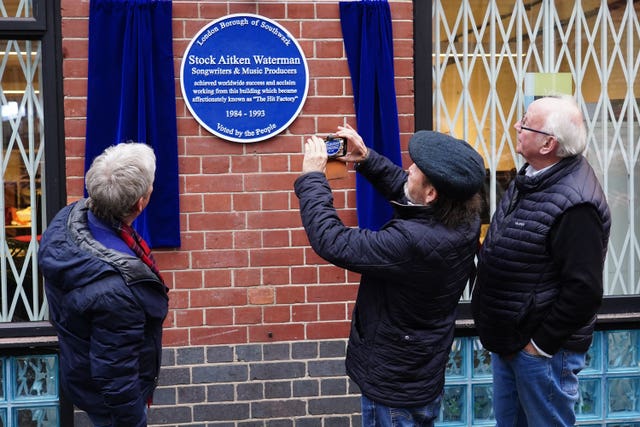 (left-right) Mike Stock, Matt Aitken and Pete Waterman during the unveiling of a Historic England blue plaque in their honour at Vine Yard Studios in London