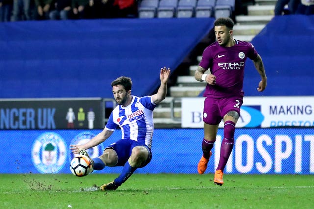 Will Grigg scored the winner as City suffered a shock loss at Wigan 