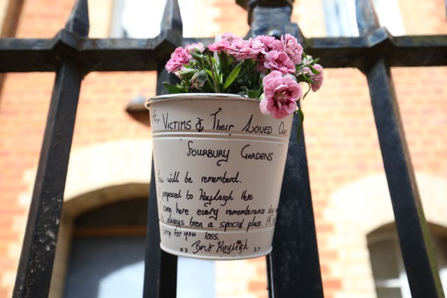 Flowers and a message left at the Abbey gateway of Forbury Gardens