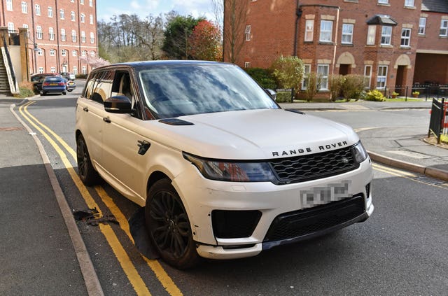 A damaged white Range Rover after reports of a crash with parked cars in the Dickens Heath area of Solihull
