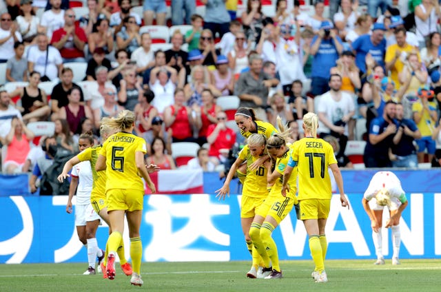 Sofia Jakobsson (fourth right) celebrates scoring Sweden's second goal