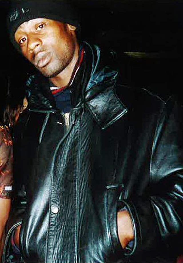 Marvin Couson wearing a black leather jacket and a black hat.