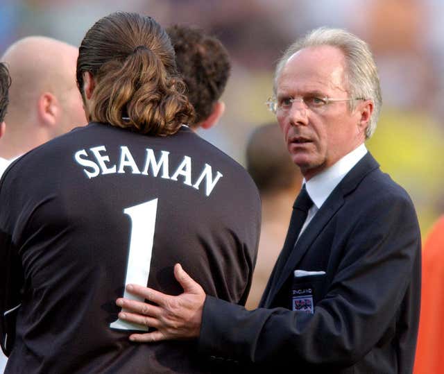 England keeper David Seaman is consoled by Eriksson after the Brazil defeat