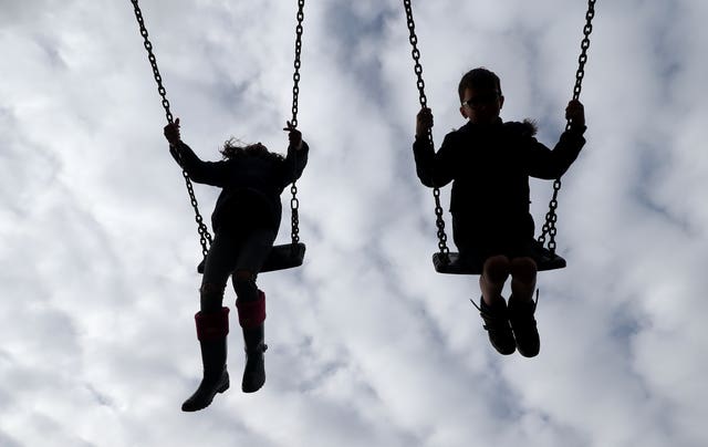 Children on a swing (Gareth Fuller/PA)