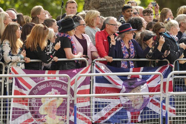 Crowds on the Mall watch the procession of the Queen's coffin